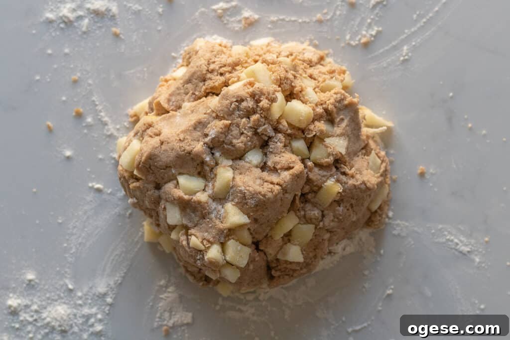 Apple Cinnamon Scones with Crunchy Cinnamon Topping 4 apple cinnamon scone dough sitting on a marble counter