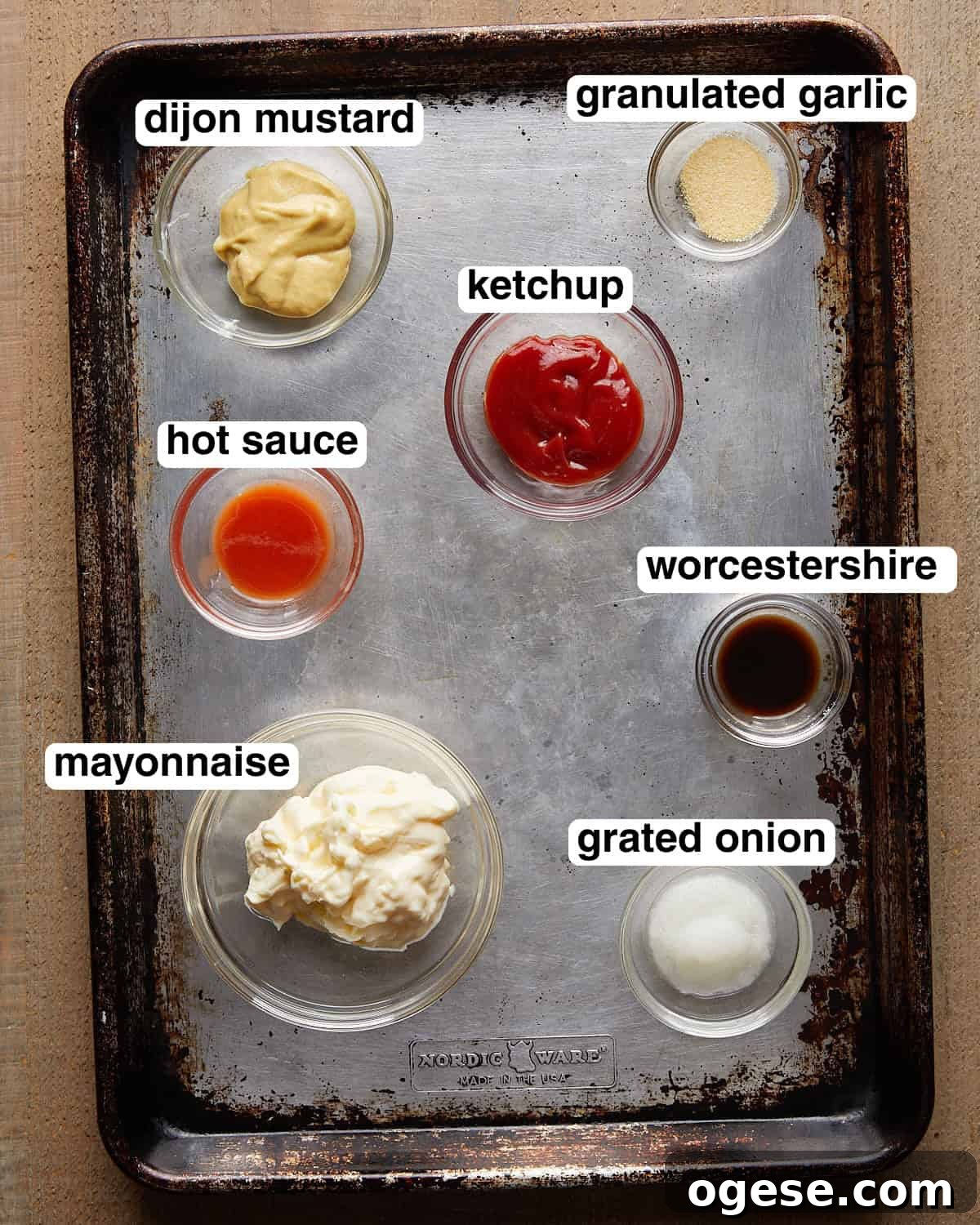 Creamy Burger Sauce Recipe Without Pickles or Relish 3 Labeled burger sauce ingredients arranged on a sheet pan.