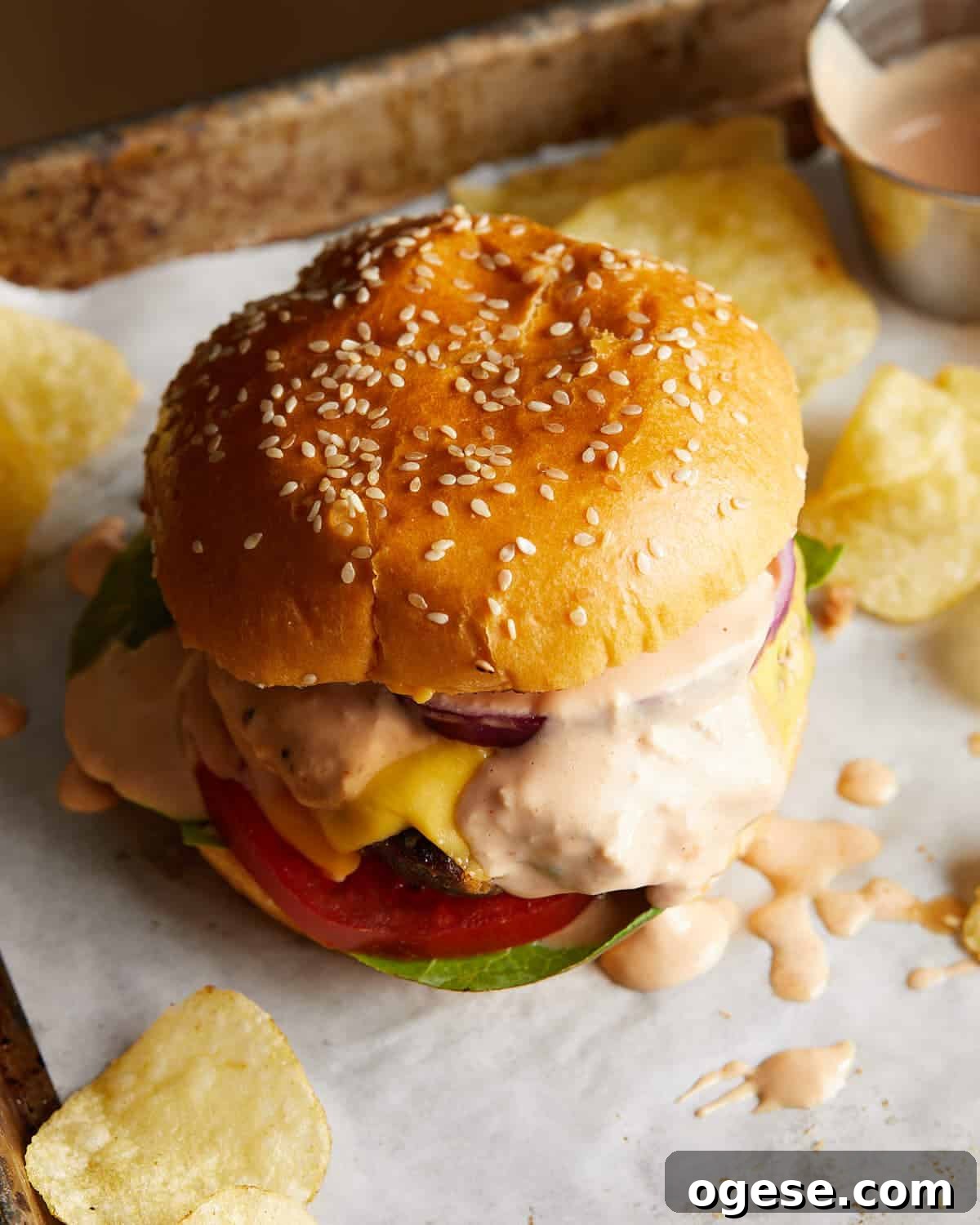 Creamy Burger Sauce Recipe Without Pickles or Relish 5 Close-up of a toasted burger bun spread with burger sauce.