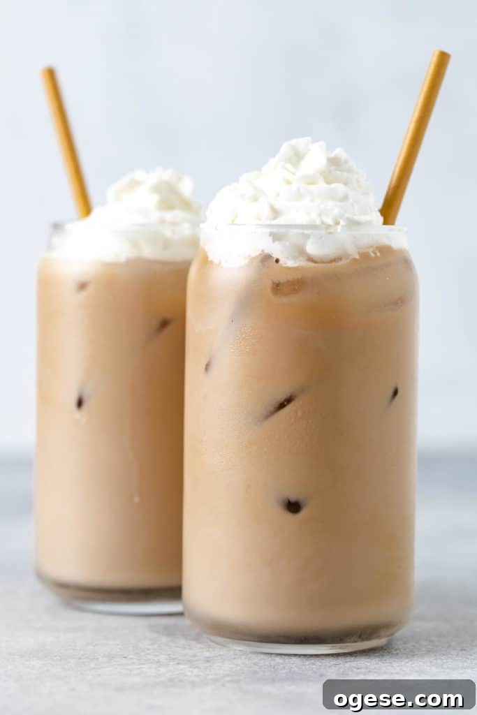 Iced Blonde Vanilla Latte Recipe: Creamy Cold Coffee Guide 5 Two iced blonde vanilla lattes in can glasses.