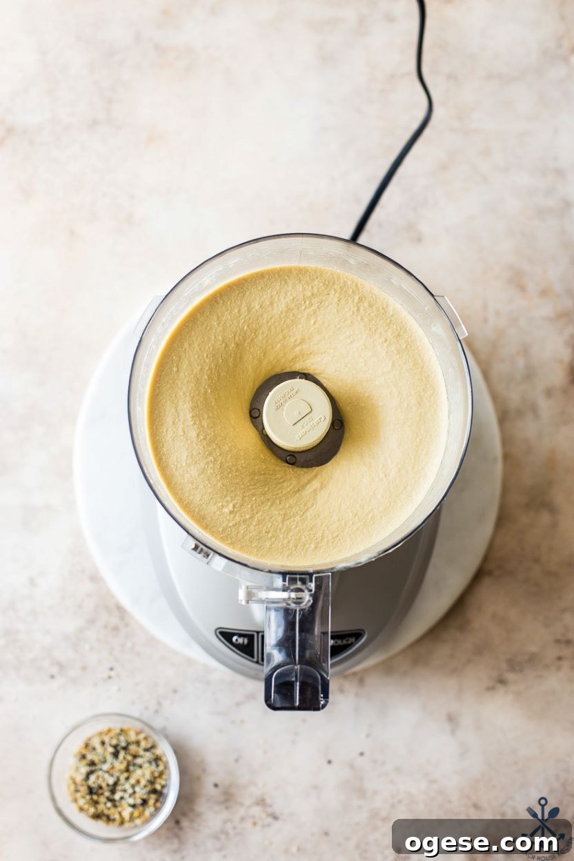 Ultimate Guide to Hummus: Recipes, Tips, and Serving Ideas 5 Overhead photo of a food processor of hummus