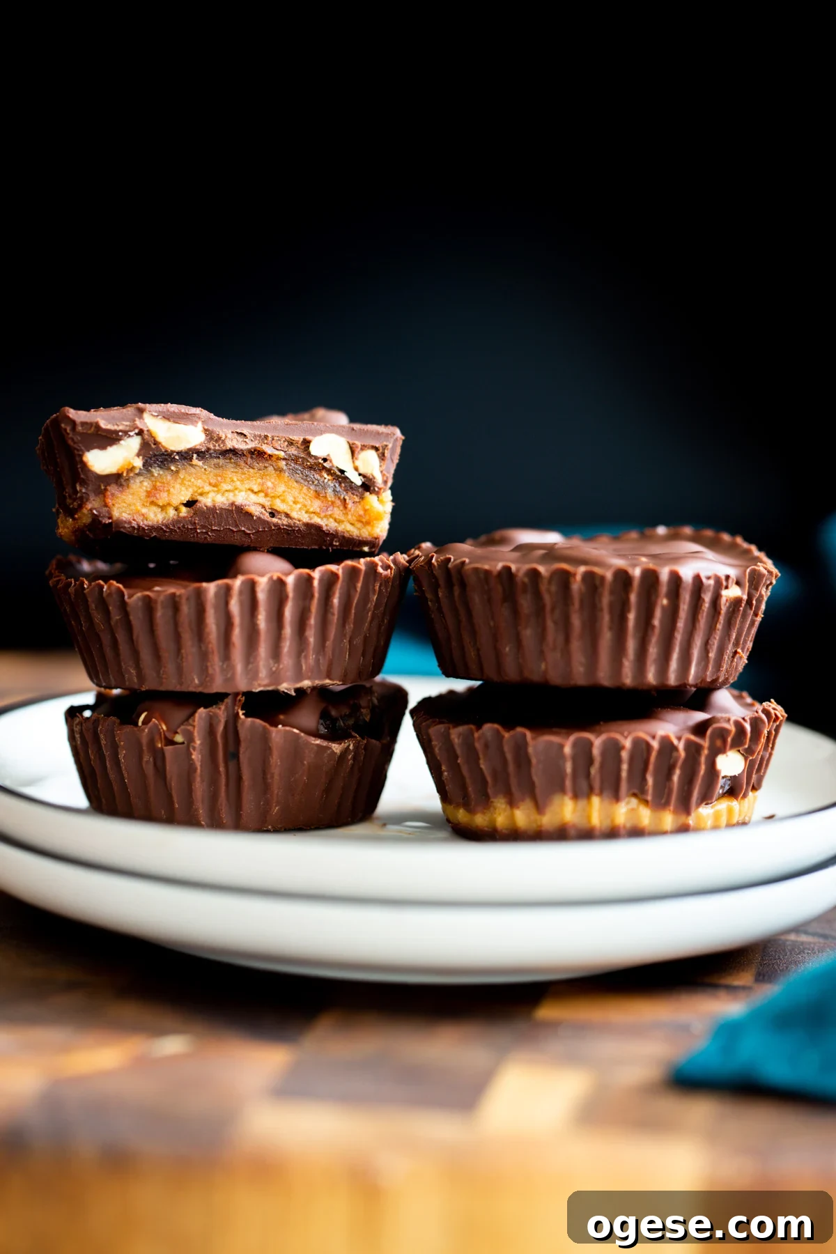 Vegan Snickers-Style Peanut Butter Cups Recipe 2 two stacks of vegan snickers peanut butter cups on a white plate