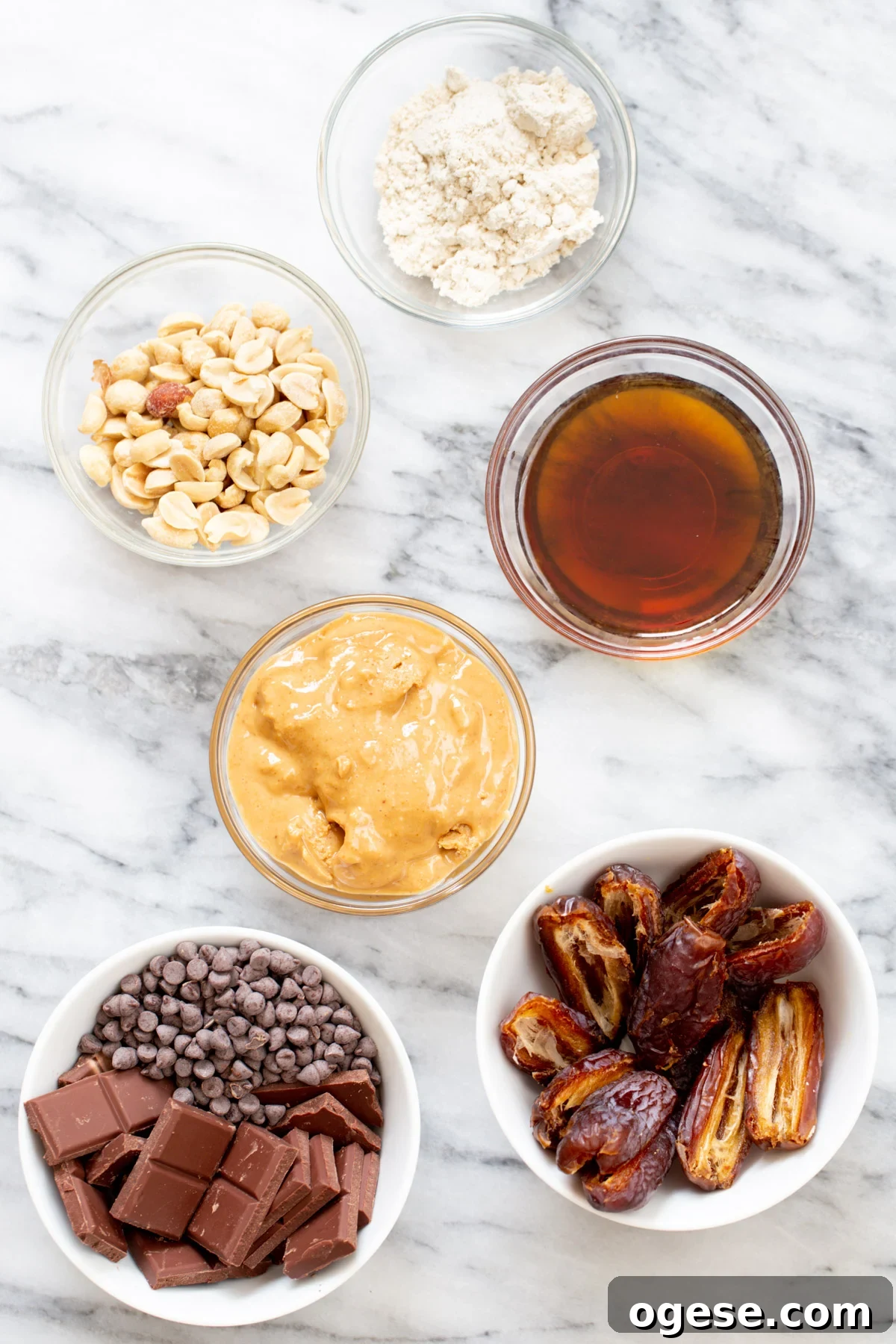 Vegan Snickers-Style Peanut Butter Cups Recipe 6 ingredients for vegan peanut butter cups on a marble slate