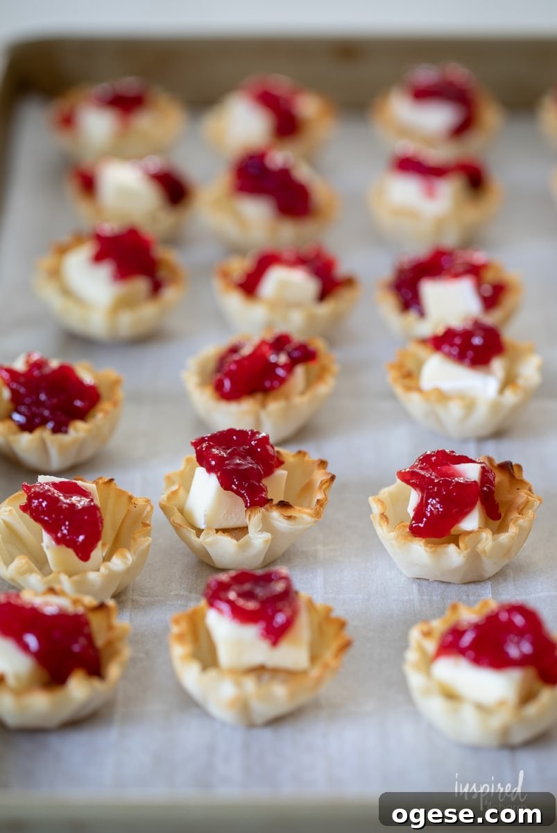 Cranberry Brie Bites on a baking sheet.