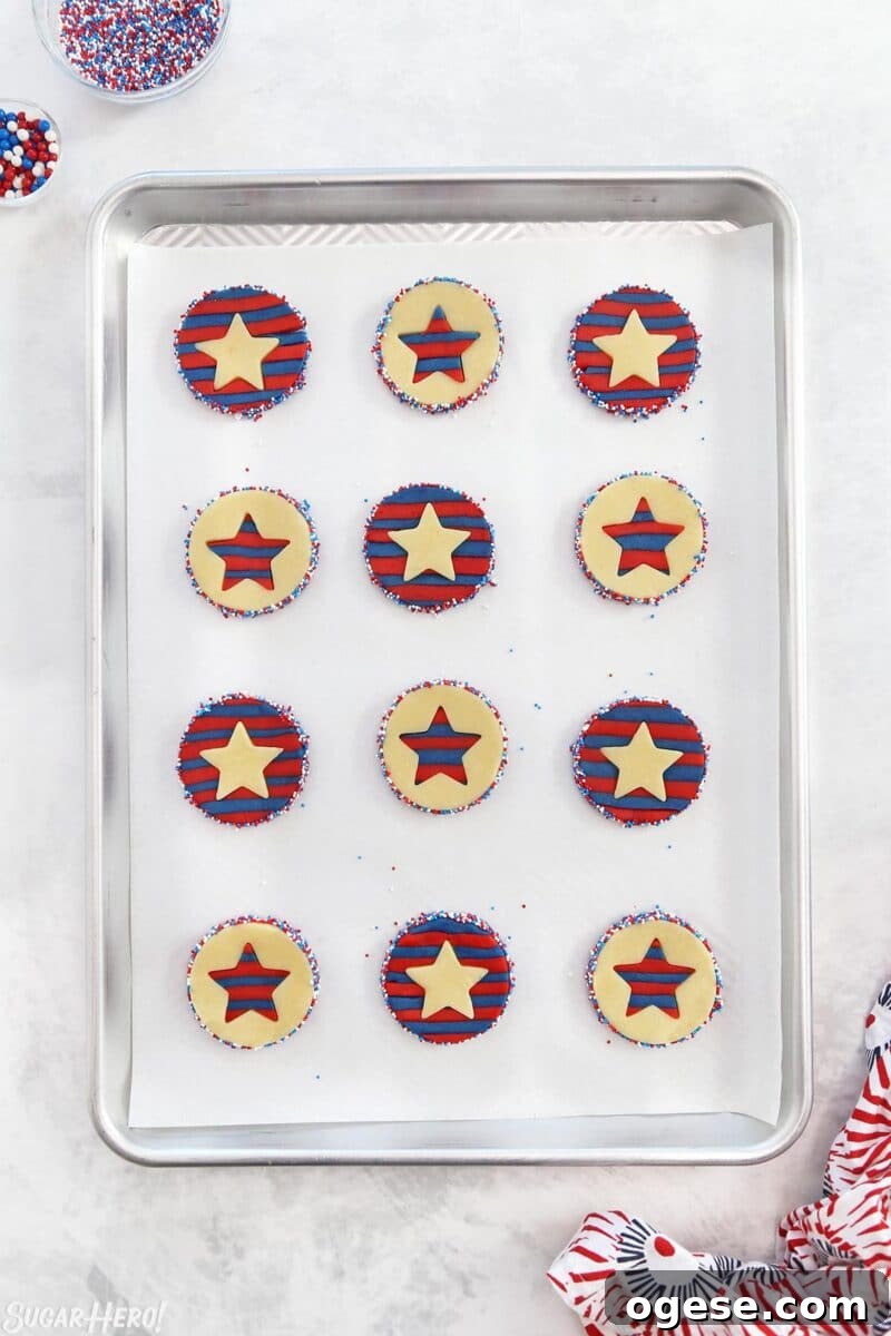 Overhead shot of Stars and Stripes Sugar Cookies on a silver baking sheet ready to bake.
