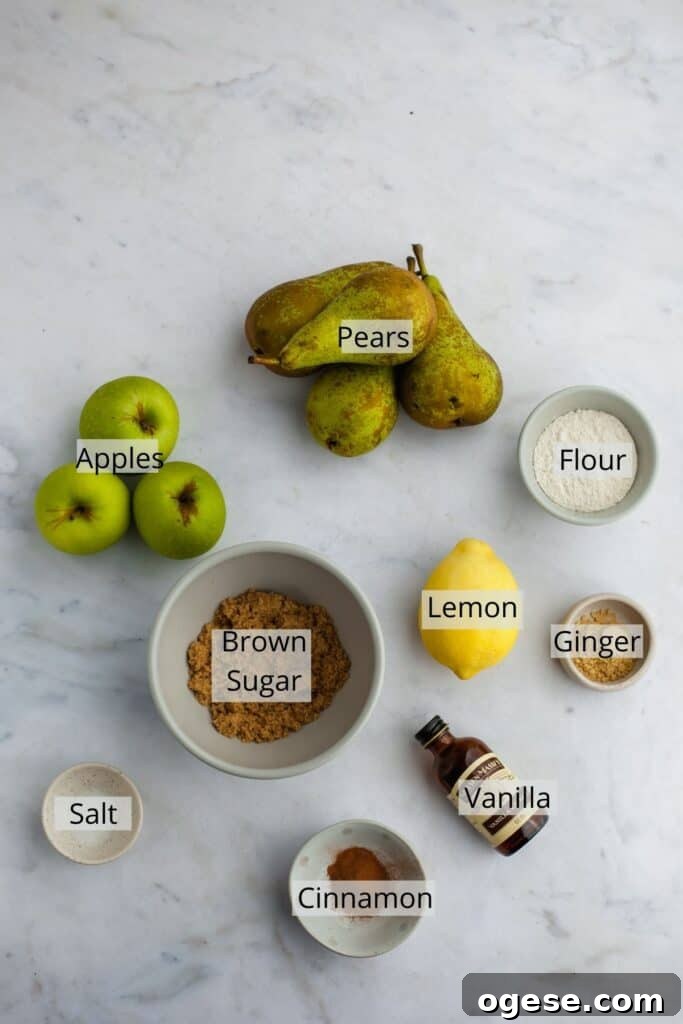 All the ingredients needed for pear and apple crisp weighed out into small bowls.