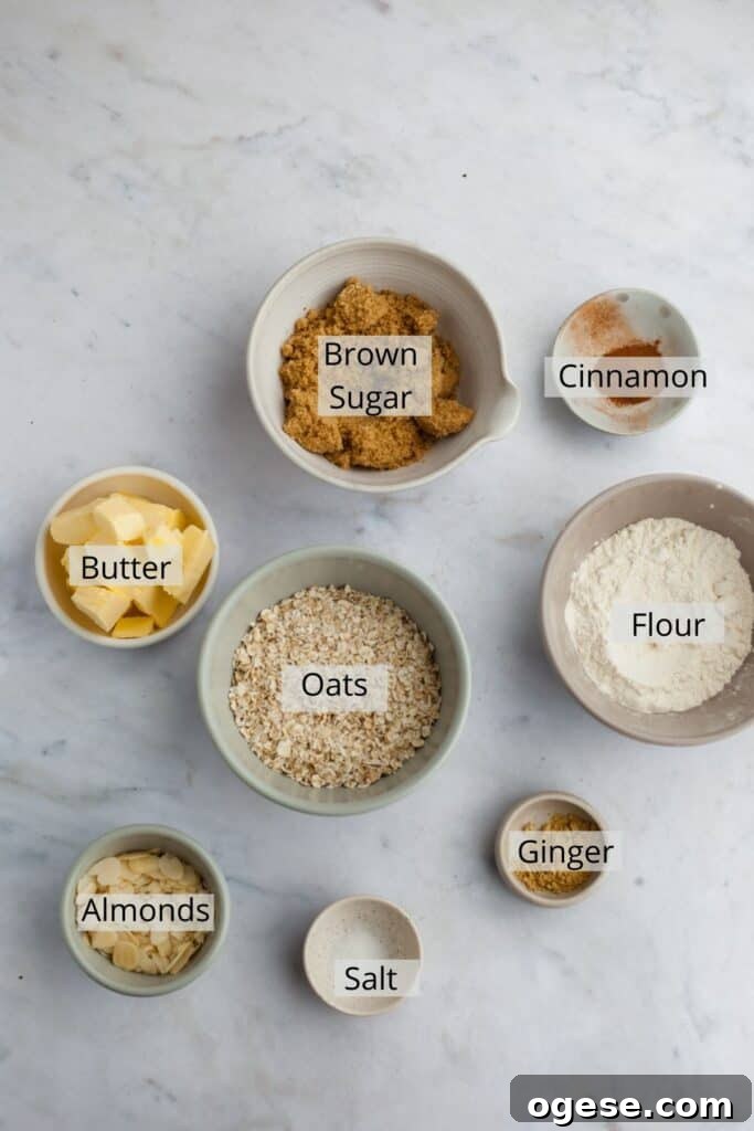 ingredients for ginger oat topping weighed out into small bowls.
