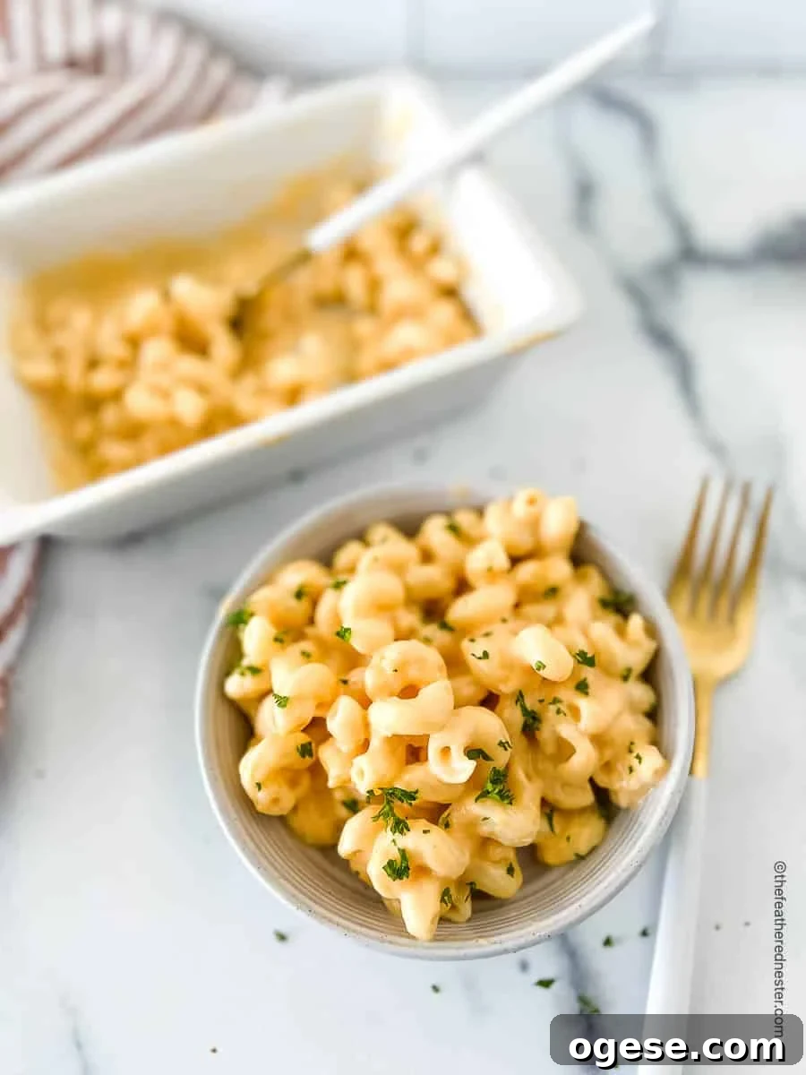 Macaroni with Velveeta cheese sauce in a bowl.