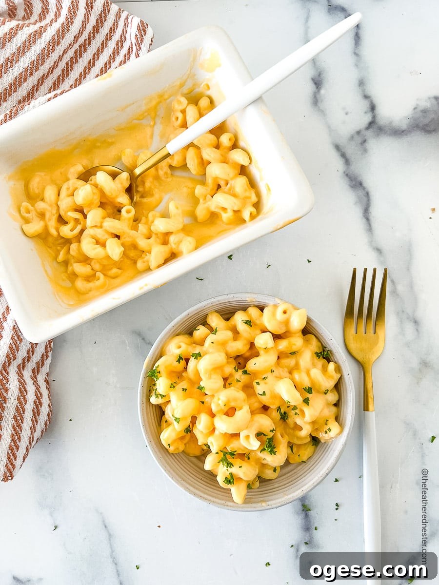 top view photo of macaroni with Velveeta cheese sauce in a bowl and another one in a serving platter.