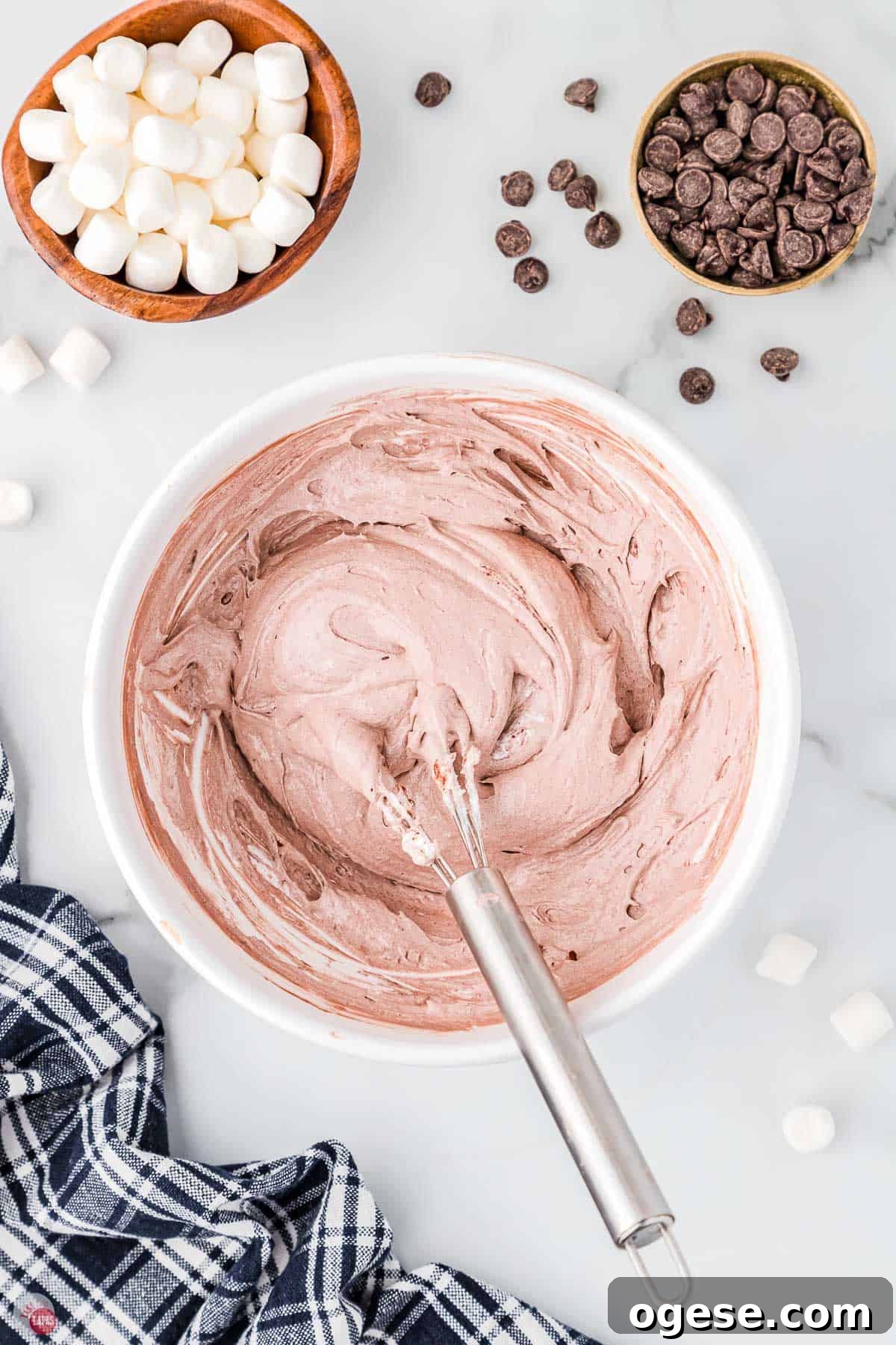 Hot Cocoa Dip Recipe for Dipping Cookies and Fruit 5 bowl of dip being mixed with a whisk