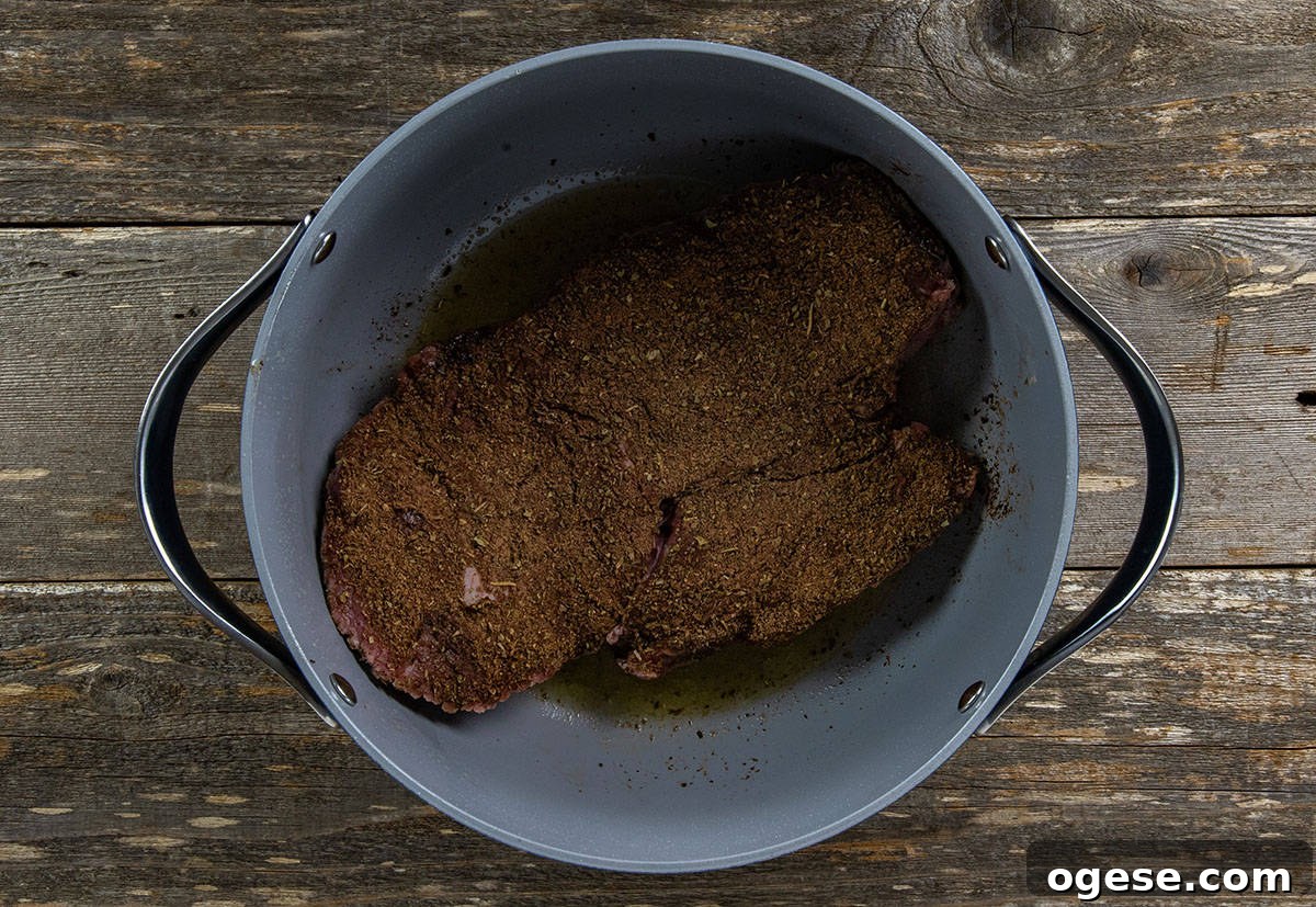 Seasoned roast in a Dutch oven.
