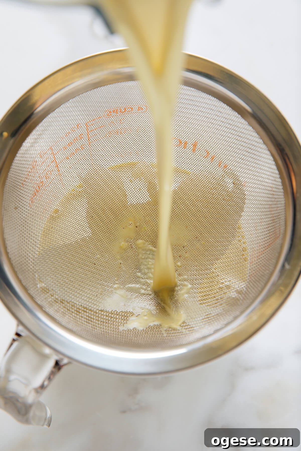 straining pistachio milk