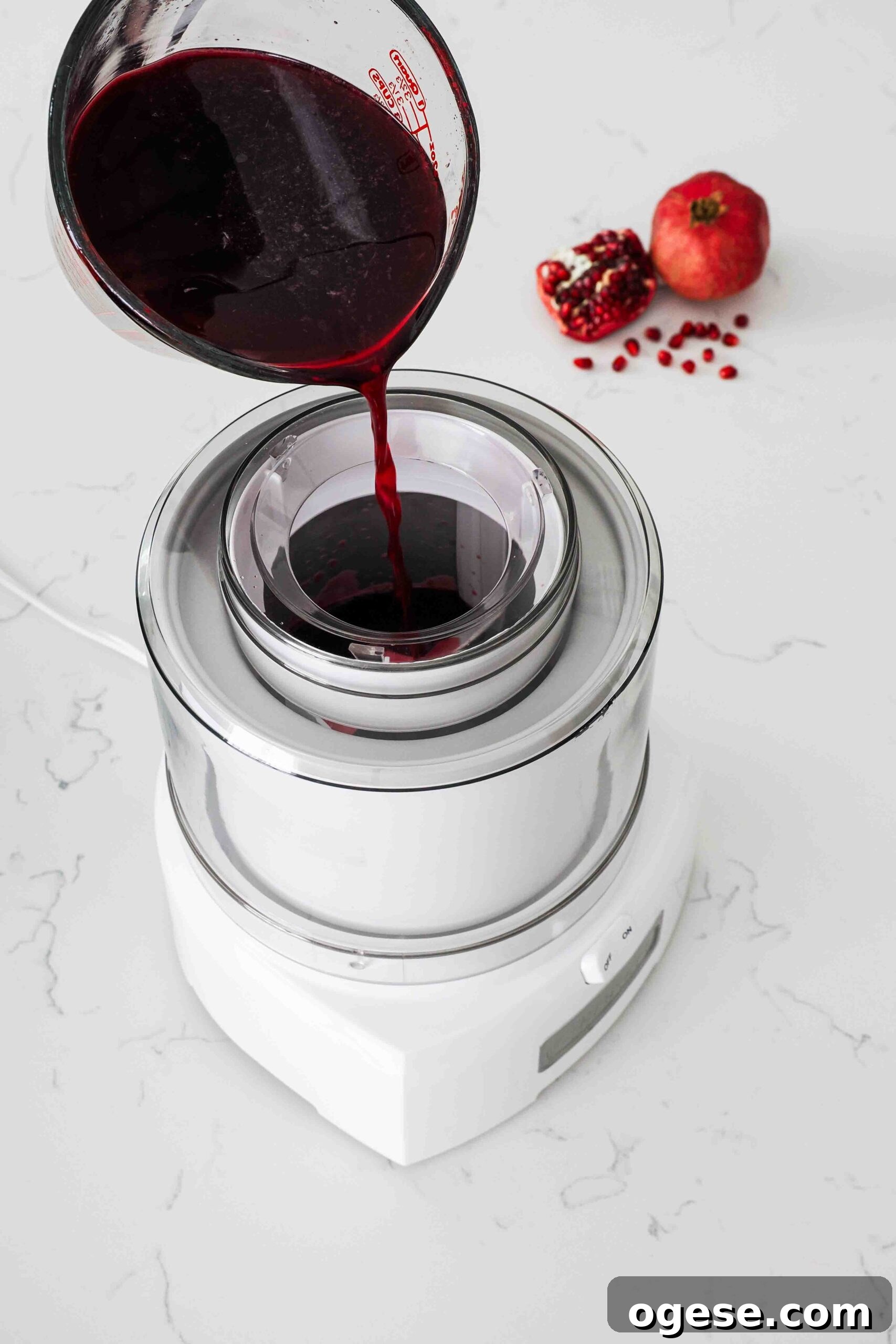 Pomegranate sorbet mix is poured into an ice cream maker.