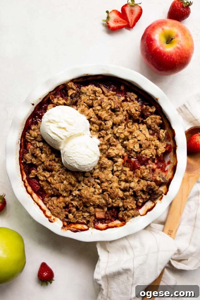 strawberry apple crumble with vanilla ice cream on top