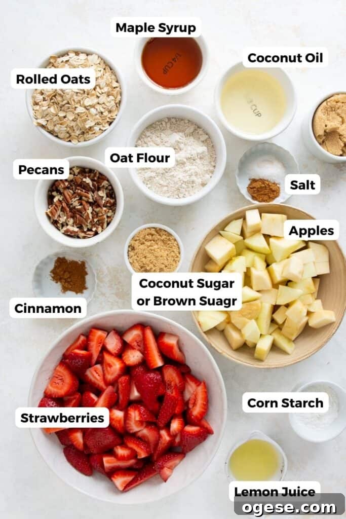 all ingredients in strawberry apple oat crumble in small bowls with labels