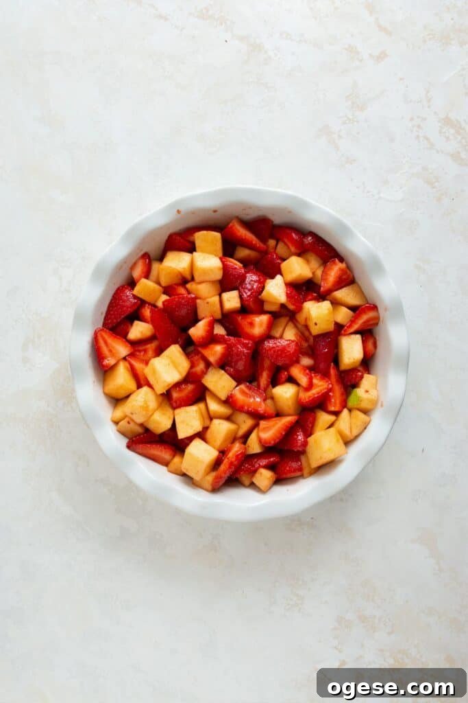 strawberry and apple filling in a pie dish