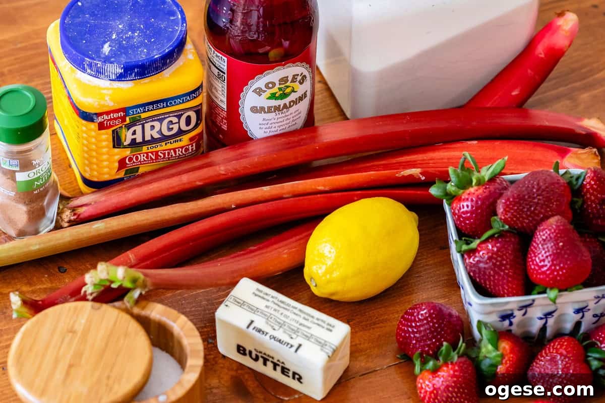 ingredients for strawberry rhubarb pie like rhubarb, strawberries, butter, lemon, etc.