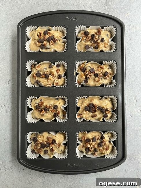 Unbaked chocolate chip loaf with bananas in a mini loaf pan.