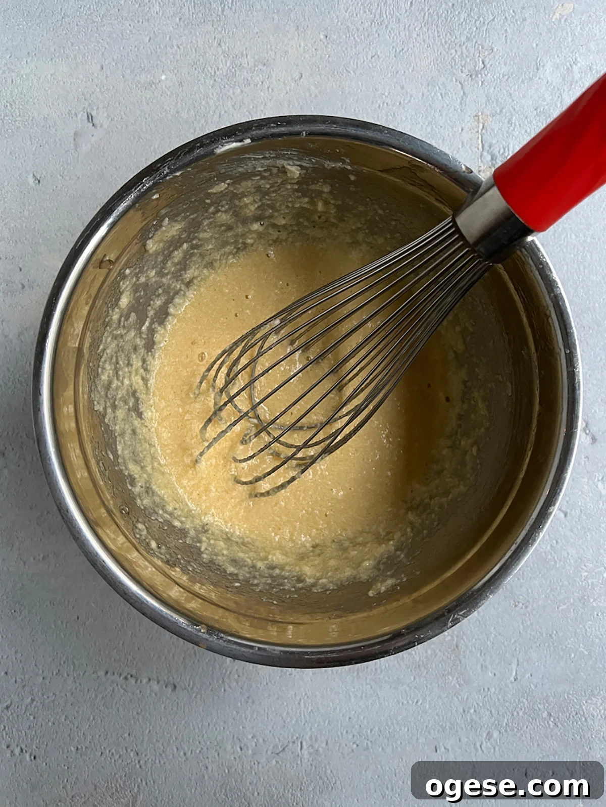 Mix eggs into creamed butter and sugar.