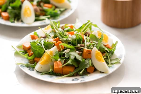 sweet-potato-arugula-salad - This Sweet Potato Arugula Salad is packed with pistachios, sweet potato, feta cheese and a delicious honey Dijon vinaigrette that pairs deliciously with arugula.