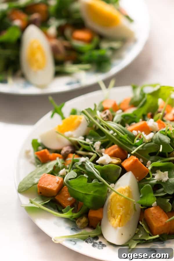 sweet-potato-arugula-salad - This Sweet Potato Arugula Salad is packed with pistachios, sweet potato, feta cheese and a delicious honey Dijon vinaigrette that pairs deliciously with arugula.