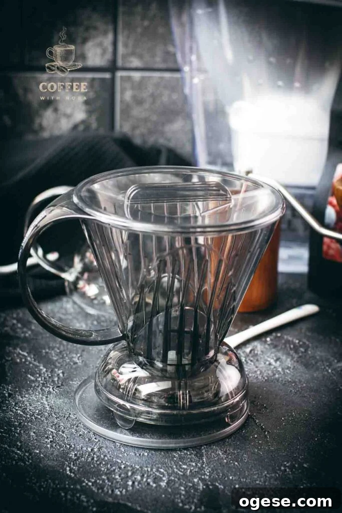 Innovative Coffee Dripper for Richer Pour-Over Flavor 3 Clever dripper in front of coffee grinder and water filter.