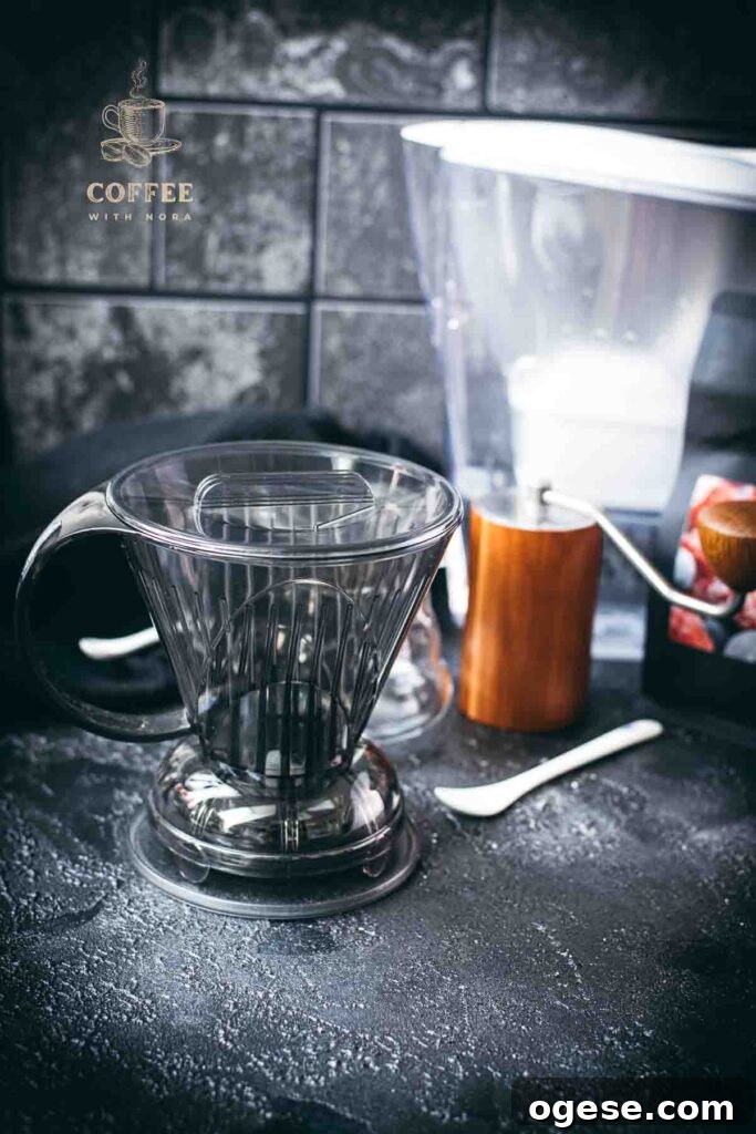 Innovative Coffee Dripper for Richer Pour-Over Flavor 4 Clever dripper next to coffee grinder and water filter.