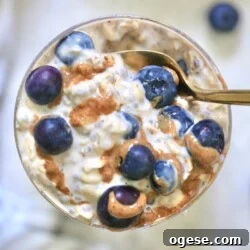 glass with blueberry oatmeal and spoon