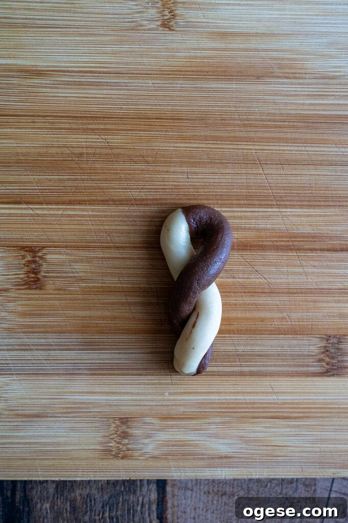 Greek Butter Koulourakia Cookies with Chocolate Swirl 16 Showing how to fold the koulourakia.