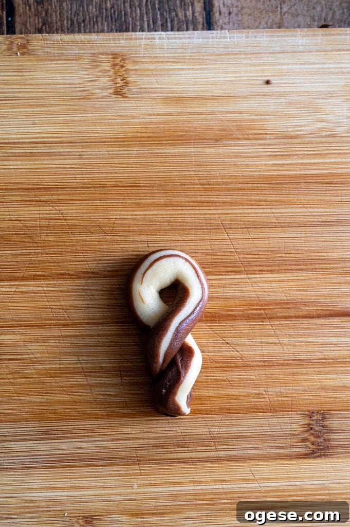 Greek Butter Koulourakia Cookies with Chocolate Swirl 21 Showing how to fold the koulourakia.