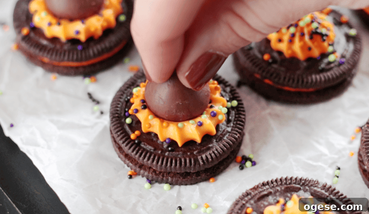 Hershey kiss pressed into frosting on oreo