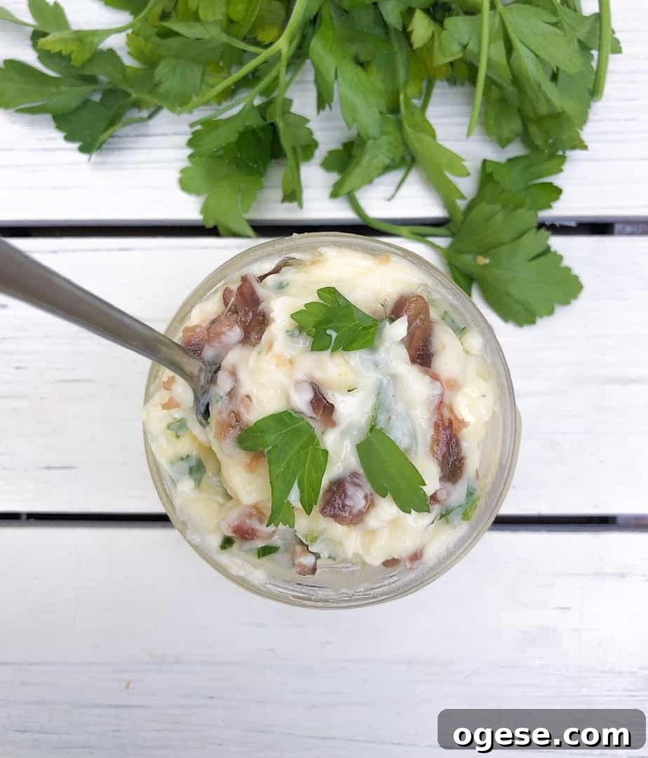 Overhead shot of garlic butter spread with anchovies.