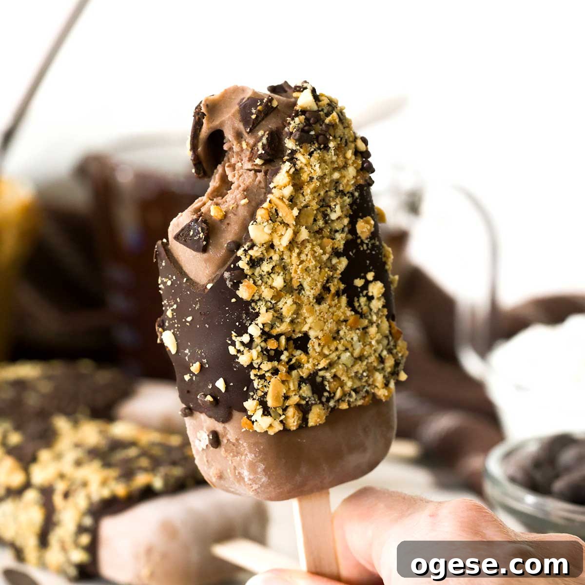 Chocolate Peanut Butter Cottage Cheese Ice Cream Bars — High-Protein Treat 2 A chocolate peanut butter cottage cheese ice cream bar dipped in chocolate and peanuts.