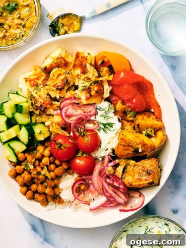 Greek Veggie Feta Bowls with tzatziki, crispy chickpeas, dill, and marinated onions.