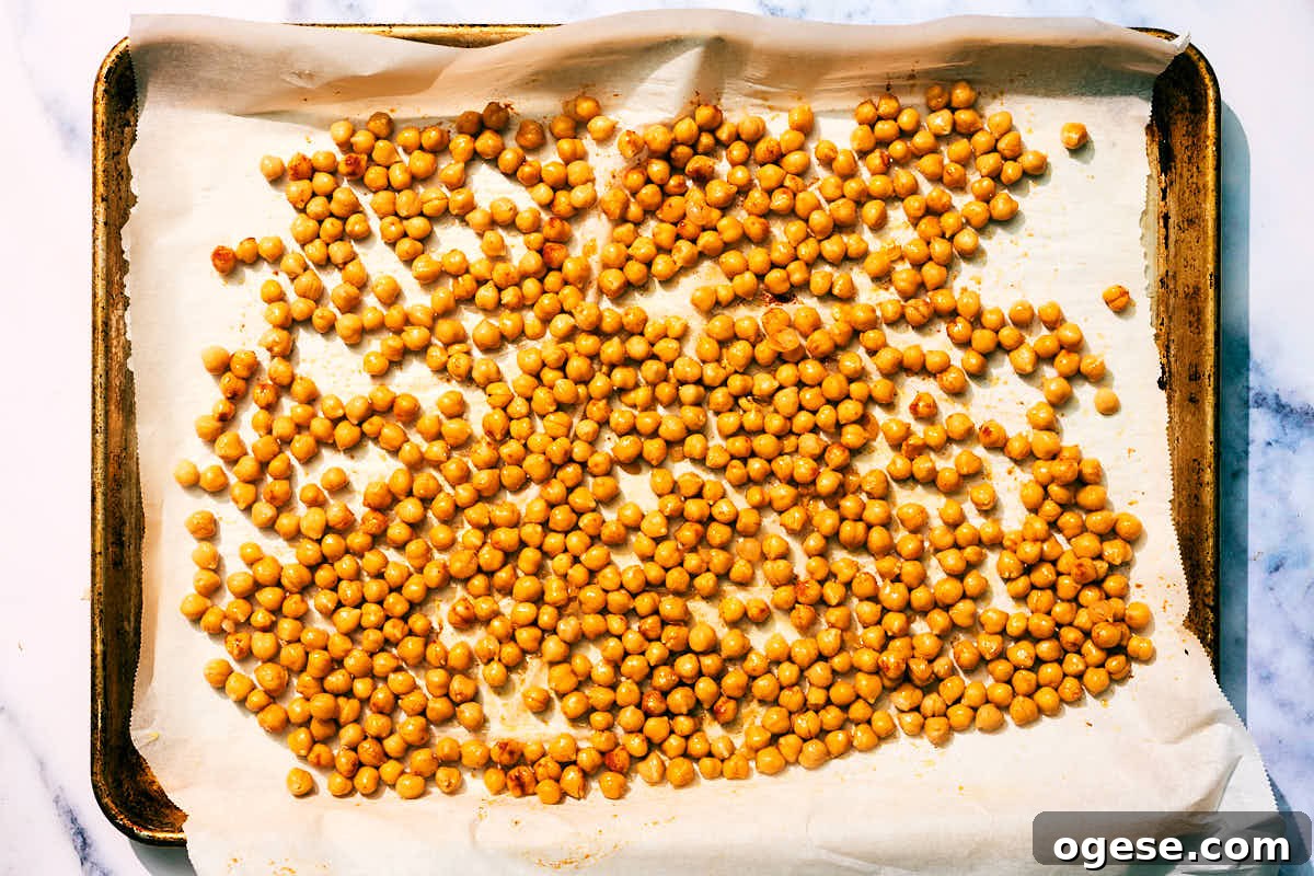 Roasted chickpeas on a baking sheet.