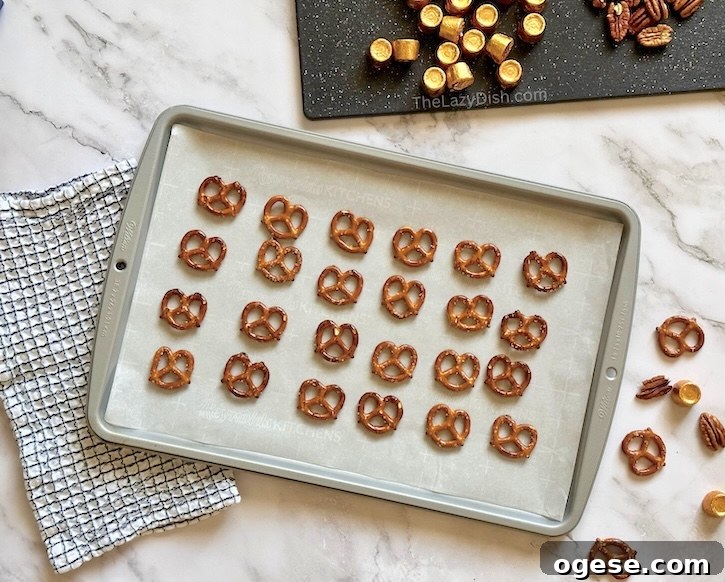 Rolo Pretzel Bites: Chocolate-Caramel Snack Recipe 4 Step by step instructions on how to make pretzels with melted Rolo candy and pecans.