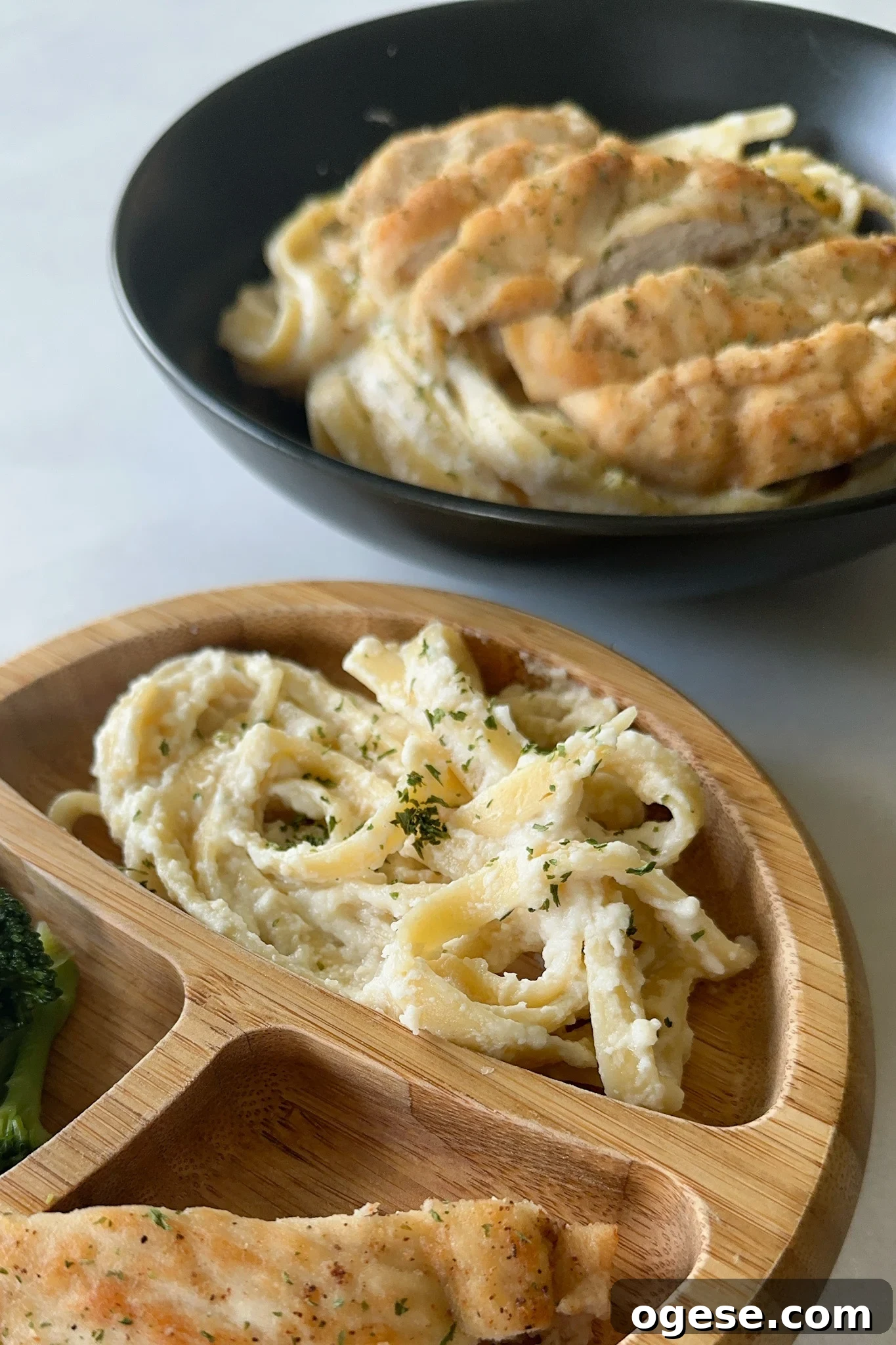 Creamy cauliflower pasta baby and adult plates.