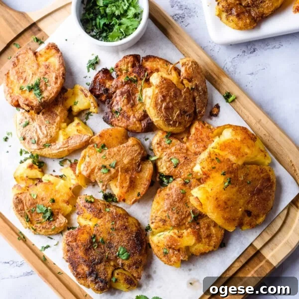 Crispy Air Fryer Nachos with Cheese & Quick Toppings 12 Close up image of garlic smashed potatoes on wooden platter.
