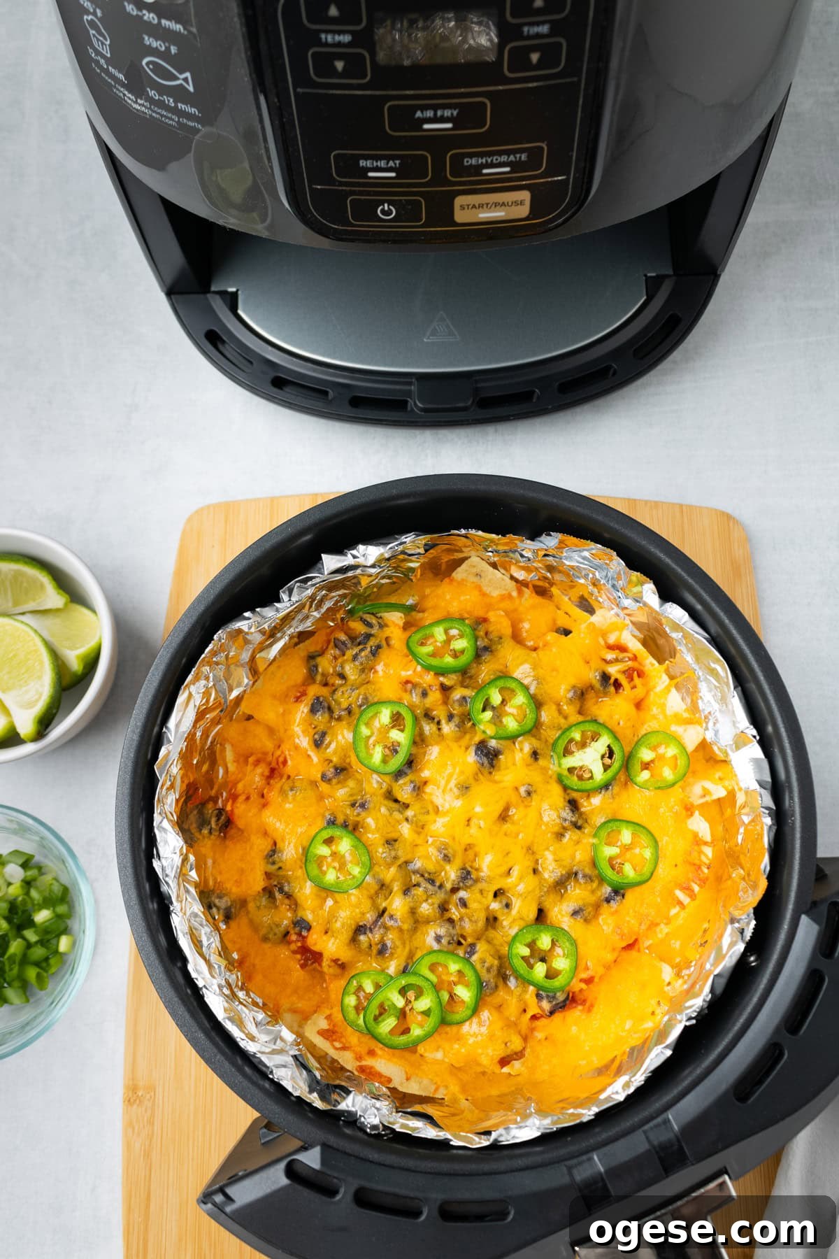 Crispy Air Fryer Nachos with Cheese & Quick Toppings 7 An overhead image of melted cheese nachos.