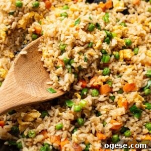 Quick Homemade Fried Rice Recipe for Perfect Weeknight Meals 8 a skillet with fried rice and a wooden spoon