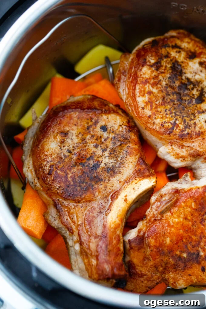 Pressure cooking pork chops with carrots and potatoes.