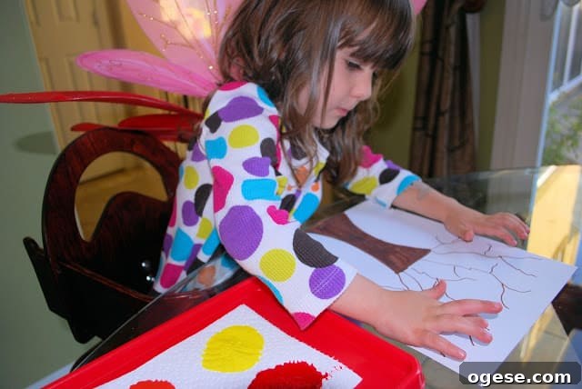 Fingerprint Fall Tree Crafts for Kids: Simple Autumn Art Project 5 child making fall crafts for kids