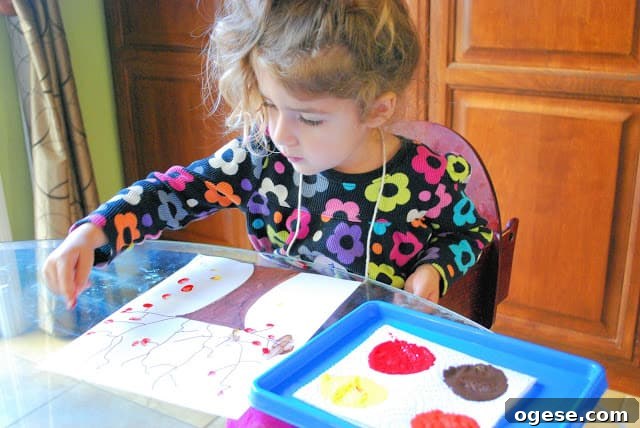 Fingerprint Fall Tree Crafts for Kids: Simple Autumn Art Project 10 child making fall tree craft