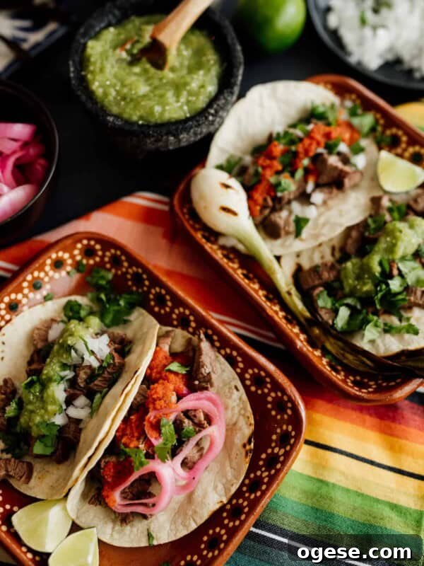 carne asada tacos on a colorful serape textile