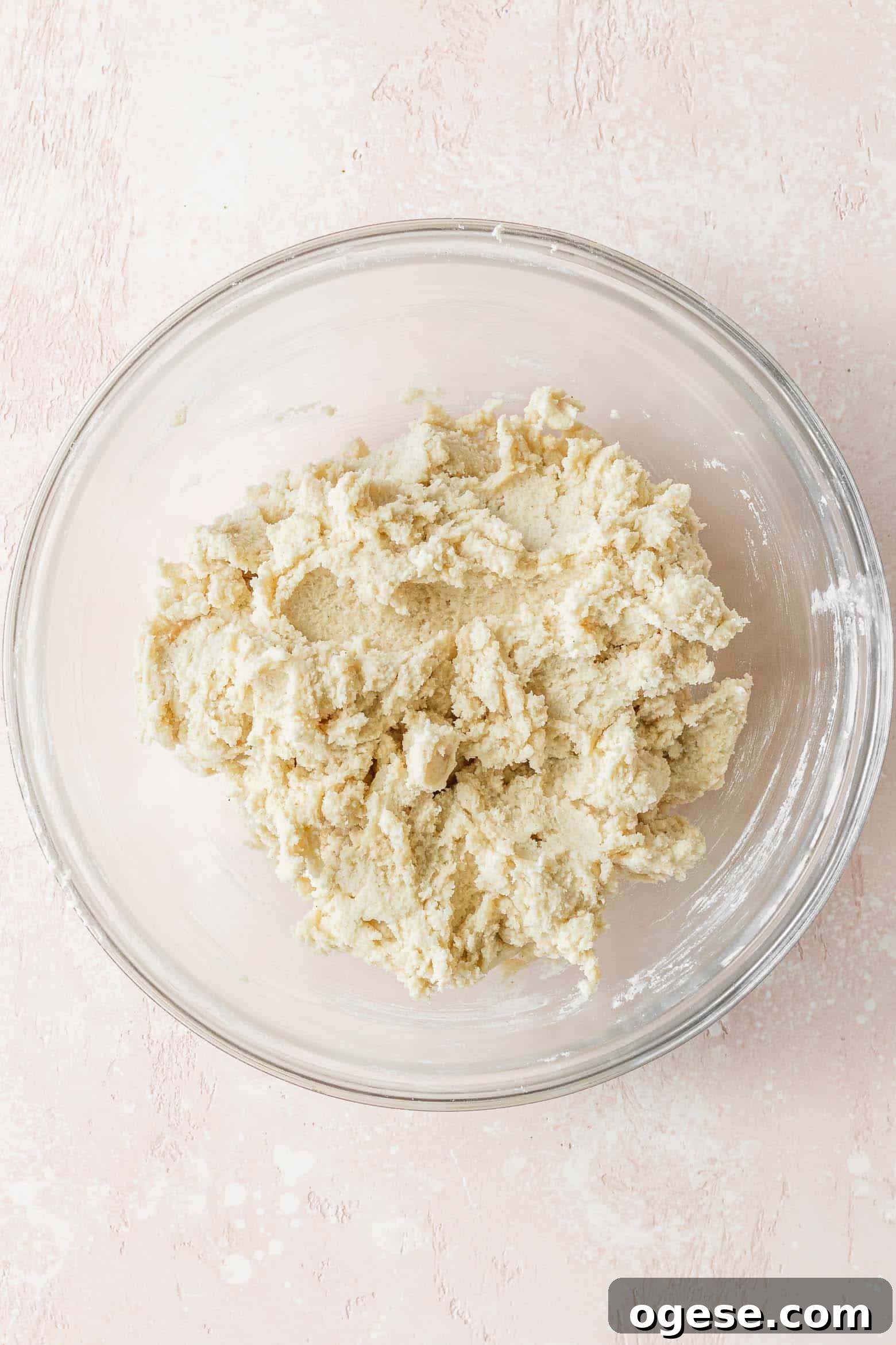 Vegan sugar cookie dough in a glass bowl.