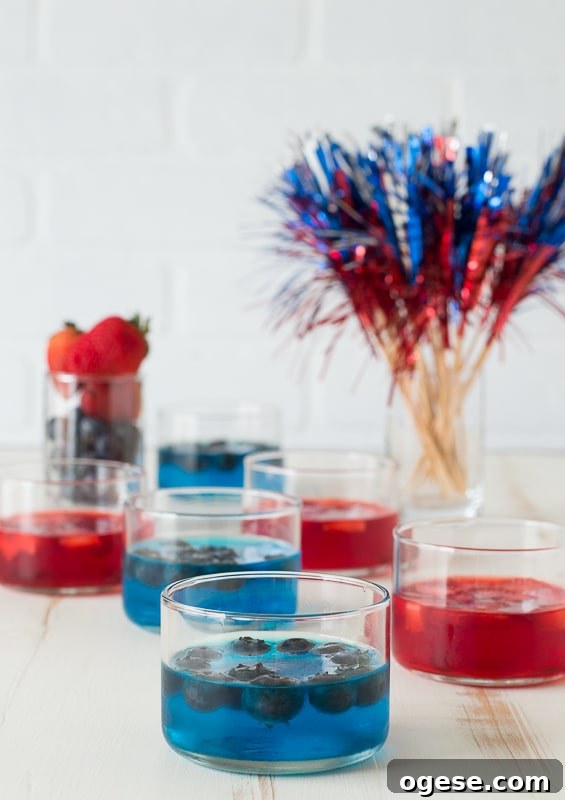 Patriotic 4th of July Fruit and Jello Cups Recipe 4 blue jello in glass cup on white background
