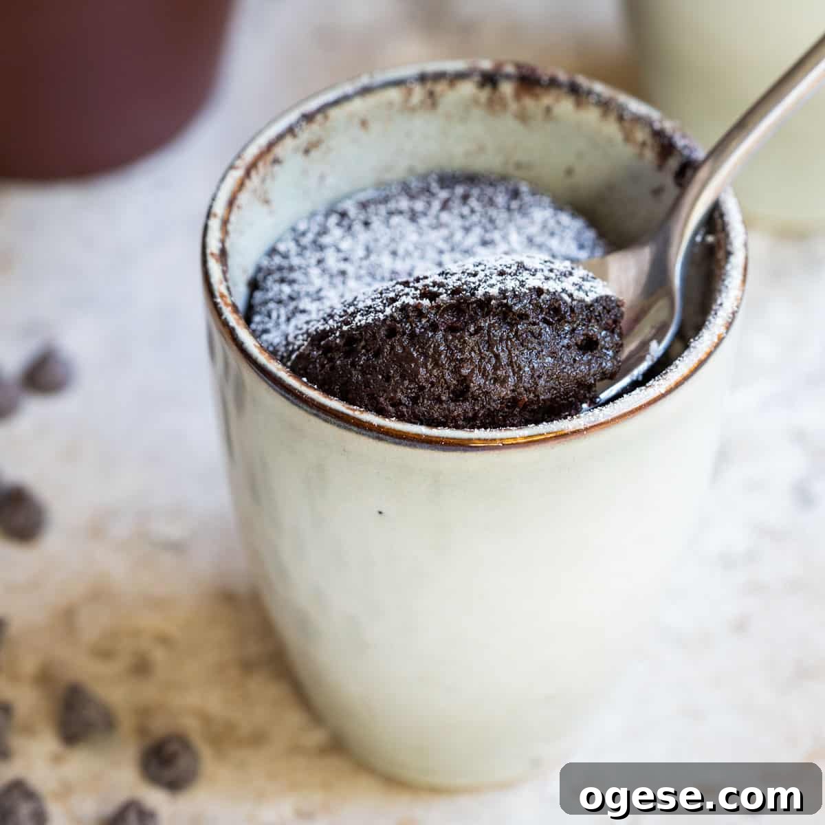 close-up of chocolate almond flour mug cake with spoon