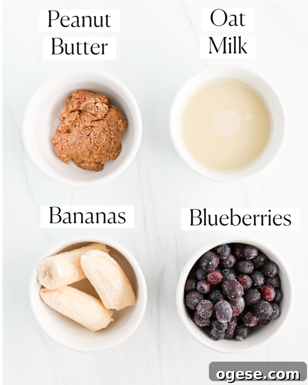 Blueberry Peanut Butter Smoothie Recipe for Creamy Energy Boost 3 Small white bowls with ingredients for a peanut butter blueberry smoothie.