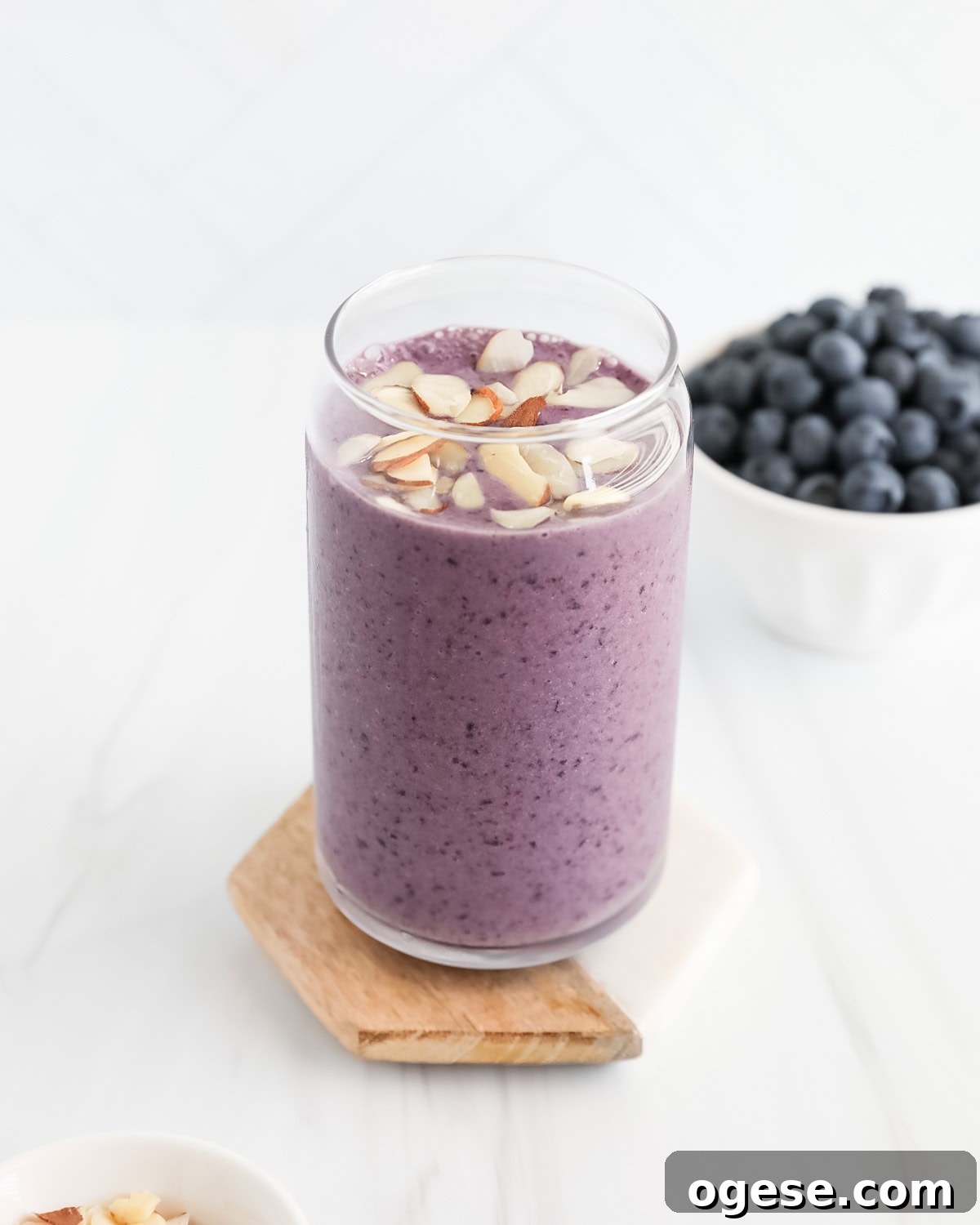 Blueberry Peanut Butter Smoothie Recipe for Creamy Energy Boost 5 Blueberry smoothie with shaved almonds on top.
