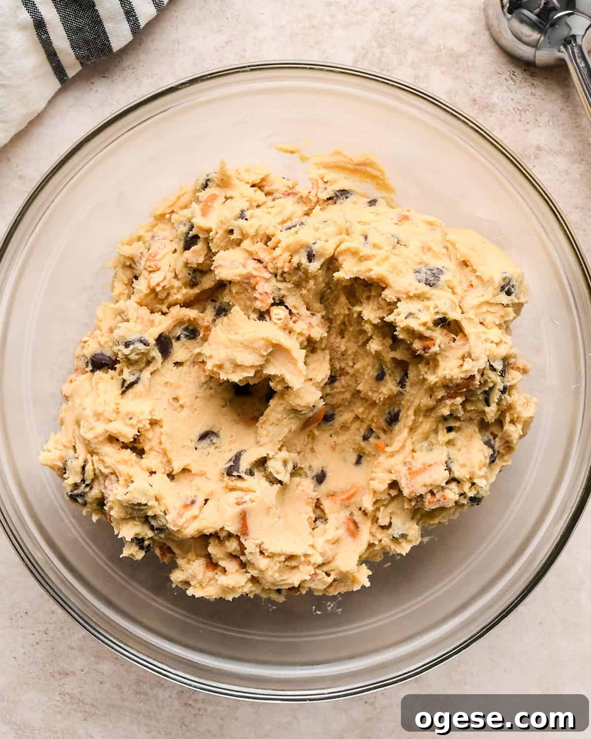 Salted Pretzel Chocolate Chip Cookies: Sweet Meets Crunch 15 chocolate chip pretzel cookies dough in a glass container to chill